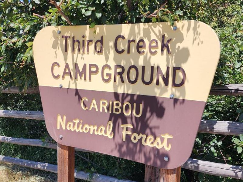 Third Creek Campground's wooden sign next to the entrance 