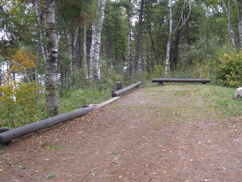 Typical campsite parking spur, with electrical hook-up.  Table,fire ring,and tent pad are accessed via steps.