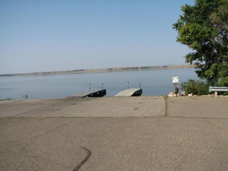3 lane boat ramp with 2 boat docks.