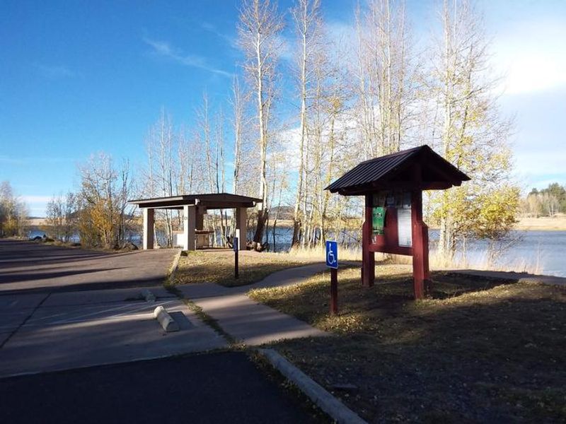Grayling Campground Information Kiosk with view of Big Lake