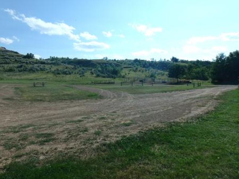 Looking at campsite toward the west. There are four corrals located on the east side of the site with dirt driveway