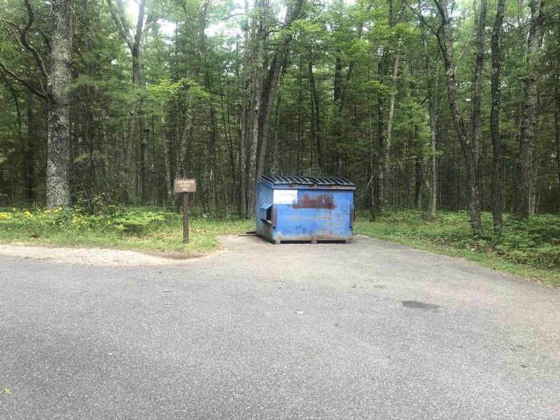 A photo of facility ROUND LAKE with No Amenities Shown 
Dumpster 