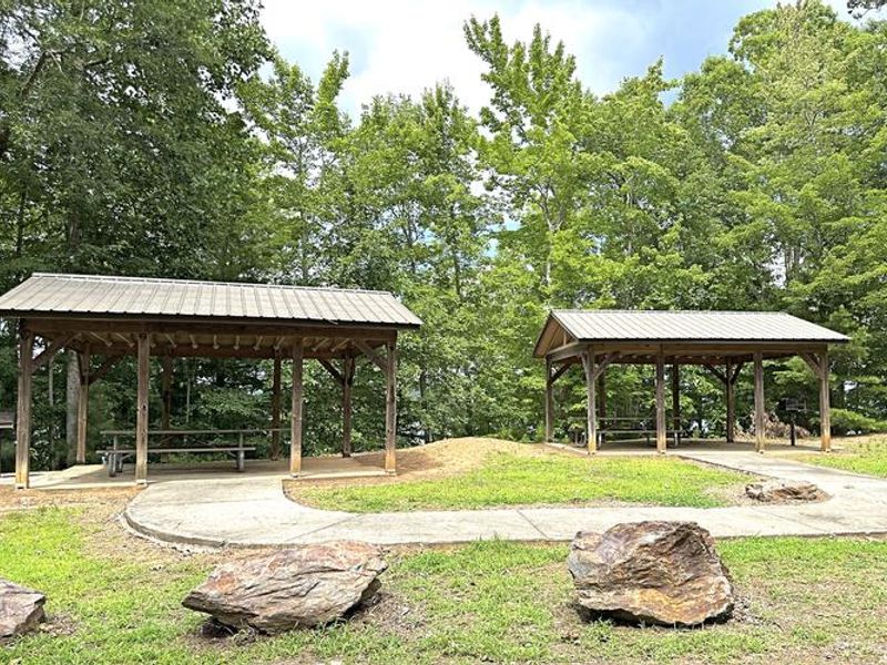 These shelters are first come, first served. No reservations necessary. Charcoal grills and tables present. Parking and restrooms nearby. 