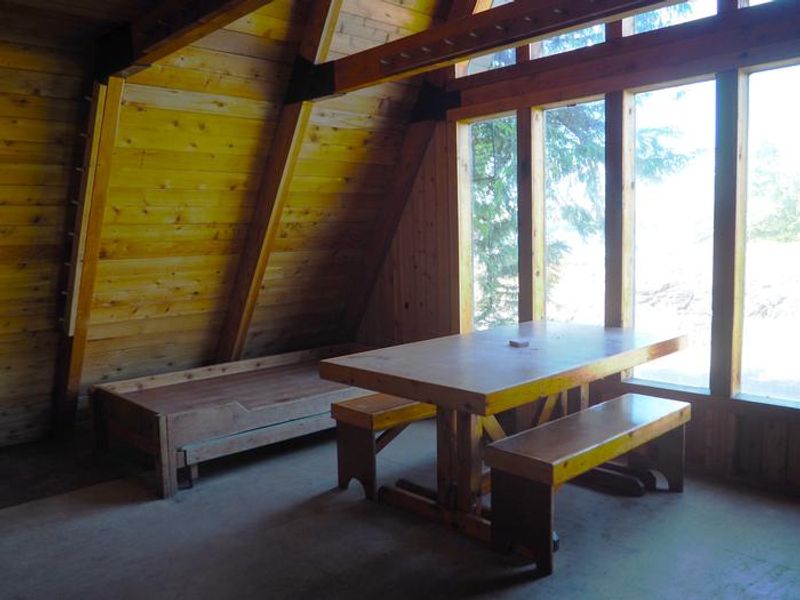 Interior of Steamer Bay Cabin showing table & bunks. 