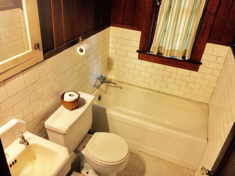 Each Cabin features a complete bath with vintage fixtures and tile.