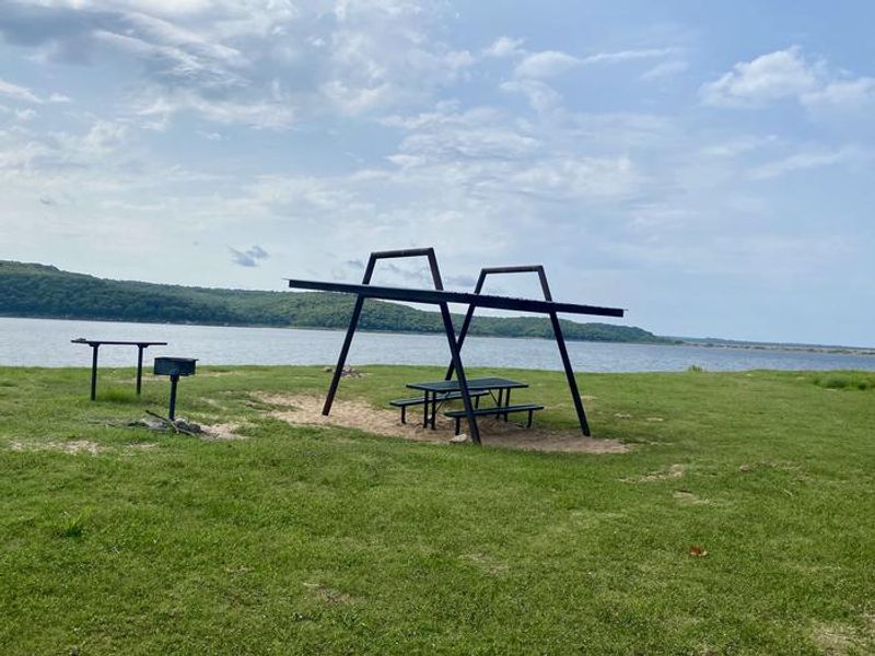 This picnic shelter is located near the water offers views of the lake. 