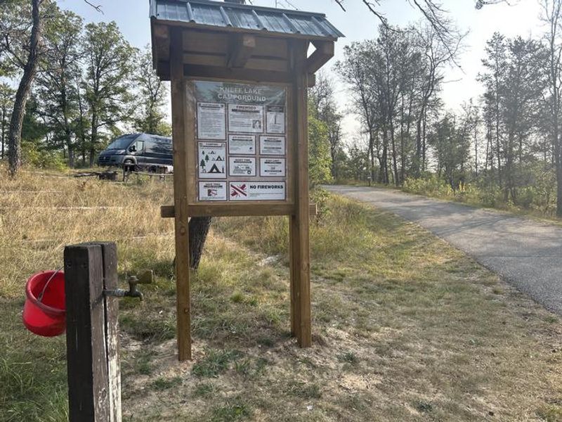 A photo of water access and information kiosk at Kneff Lake Campground