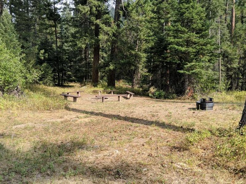 Group area for day use including five benches around a large fire pit. Adjacent to horseshoe pits. 