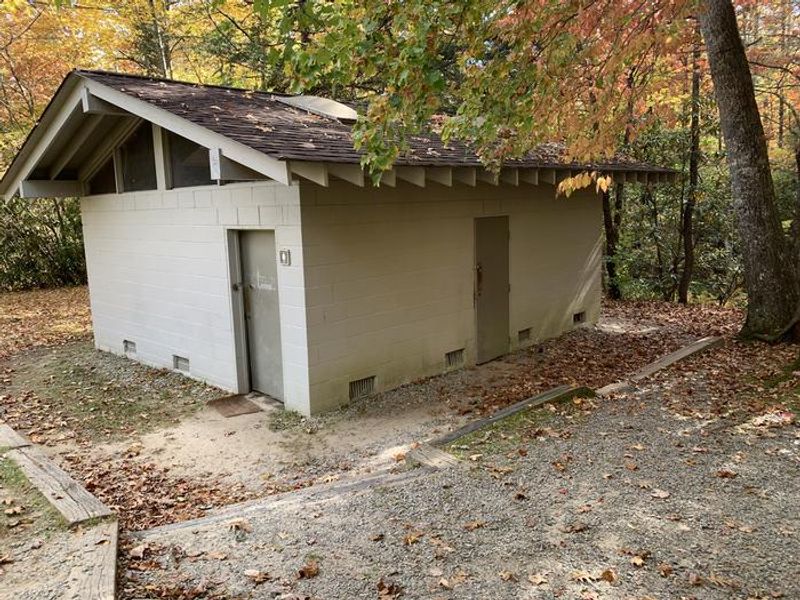 Stand alone restroom building is approximately 60-100 yards from Picnic Shelter