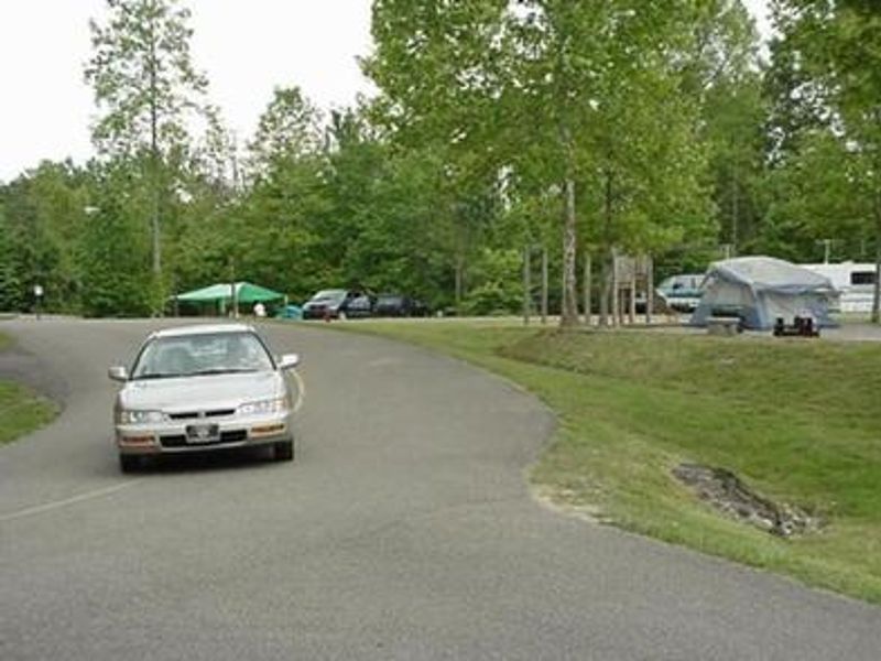 Car driving towards the campground kiosk at Blue Heron Campground.